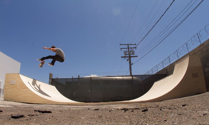 mini ramp skateboarder doing a trick" 360 flip"